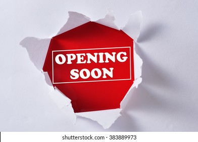 Torn Paper with Word "OPENING SOON"