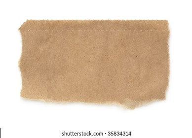 Torn Piece Of A Brown Paper Bag, Isolated On White With Soft Shadow.  Macro, With Lots Of Paper Textures And Serrated Top Edge.