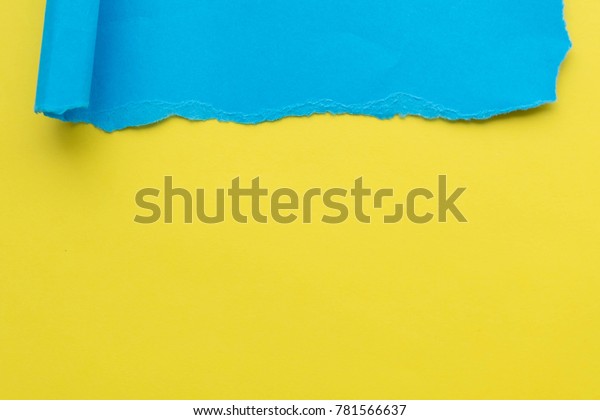 Torn\
Real Paper Scraps minimal concept. blue on\
yellow