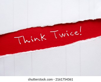 Torn red paper with handwritten messageTHINK TWICE!, means to think again or rethink before making decision,   rethinking can lead to excellence at work and wisdom in life