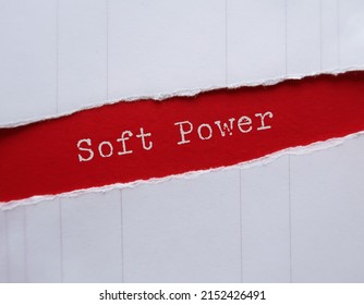 Torn Red Paper With Handwritten Text SOFT POWER (ability To Attract Shaping Preferences By Appeal Or Attraction) Opposite To Use HARD POWER (military And Economic Means To Influence Others)