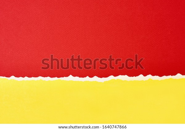Torn ripped paper edge with copy space, red\
and yellow color\
background