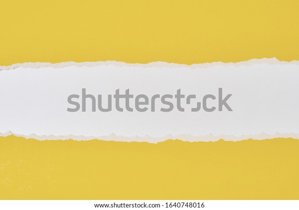 Torn ripped paper edge with copy space, white
and yellow color
background