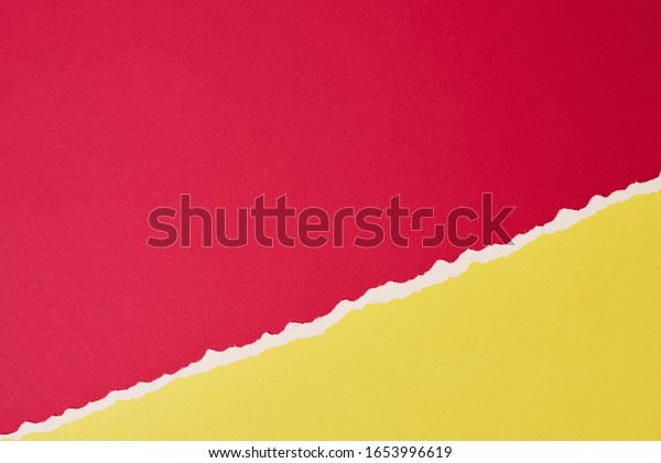 Torn ripped paper edge with copy space, red\
and yellow color\
background