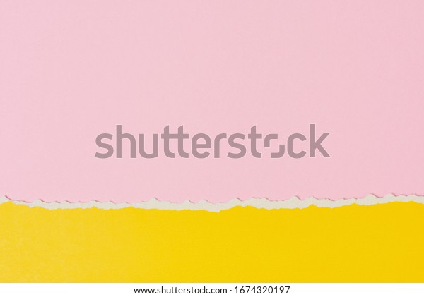 Torn ripped paper edge with copy space, pink\
and yellow color\
background
