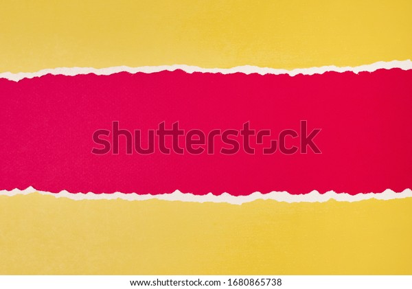Torn ripped paper edge with copy space, red
and yellow color
background