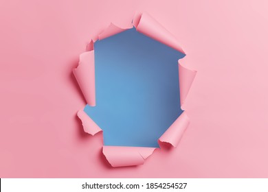 Torn ripped pink background with hole in center for your advertising content or promotion. Blank space to insert object. Absract horizontal shot. Breakthrough concept. Nobody at image. Through paper - Shutterstock ID 1854254527