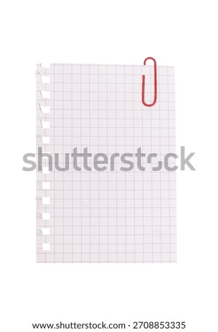 A torn sheet of squared notebook paper with a red paperclip isolated on white background — perfect for school, office, planning, or creative note-taking concepts.