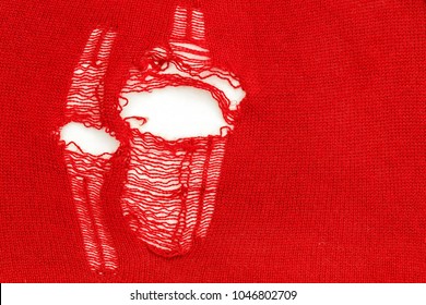 Torn Stretch Jersey Fabric. Distressed Holes And Rips In The Red Sweater Knitted From Cashmere Silk Yarn