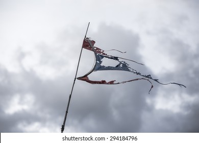 Torn thai flag waving on the wind