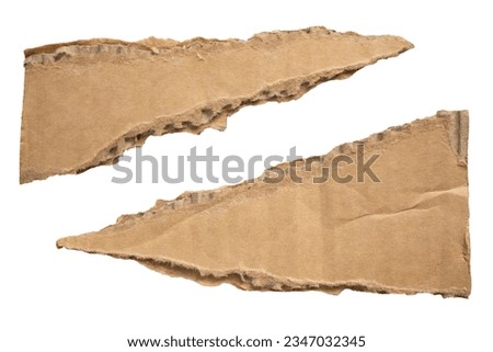 Torn triangular shaped cardboard paper on white background with clipping path