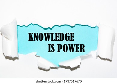 Torn white paper revealing the word knowledge is power - Shutterstock ID 1937517670