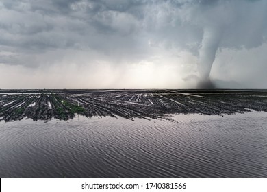 Tornado in the field. Storm weather and tornado