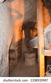 TORO, CASTILE AND LEÓN, SPAIN - FEBRUARY, 24TH, 2019: View of an industrial mill and a wine press in an 18th-century cave-cellar in the historic center of the village of Toro