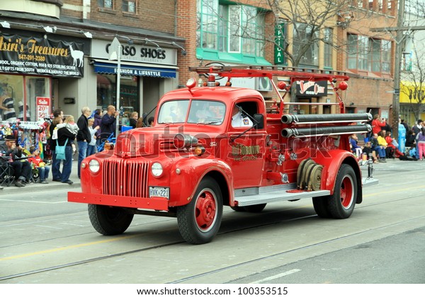 TORONTO - APRIL 8: A\
Toronto fire department vehicle during a street parade on April 8,\
2012 in Toronto. Toronto Fire Services counts on 3,100 men divided\
in 83 fire stations.
