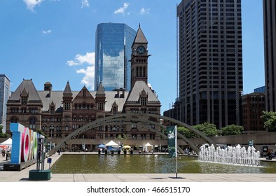 TORONTO, CANADA - 06 27 2016: View Across The Fountain On Nathan Phillips Square With Old City Hall And Cadillac Fairview Tower In Background