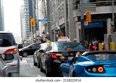 Toronto, Canada - 07-08-2018: A Taxi In Toronto Street Traffic