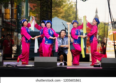 Toronto, Canada - 08 19 2018: Traditional Chinese Dance Performers On The Main Stage Of The 18th Toronto Chinatown Festival.