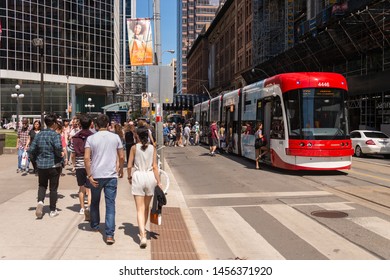 Toronto, Canada - 22 June 2019: Street Car In Downtown Toronto Going On Queen Street