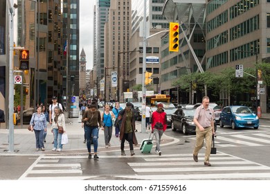 Toronto, Canada - 26 June 2017: A Crowd Of People Crossing Front Street In Downtown Toronto