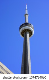 TORONTO, CANADA -27 MAR 2019- Day view of the landmark CN Tower, a communications and observation tower located in downtown Toronto, Ontario, Canada.