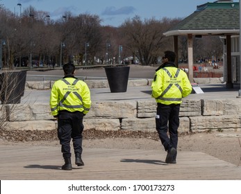 Toronto Canada, April 10, 2020; Response To Covid-19 Pandemic Social Distance Enforcement Bylaw Officers On The Boardwalk Of The Eastern Beach Boardwalk In Toronto.