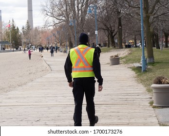 Toronto Canada, April 10, 2020; Response To Covid-19 Pandemic Social Distance Enforcement Bylaw Officers On The Boardwalk Of The Eastern Beach Boardwalk In Toronto.