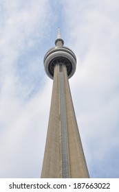 Toronto, Canada - April 13, 2014: The iconic observation deck of the CN Tower soaring into the beautiful blue Toronto skies. 