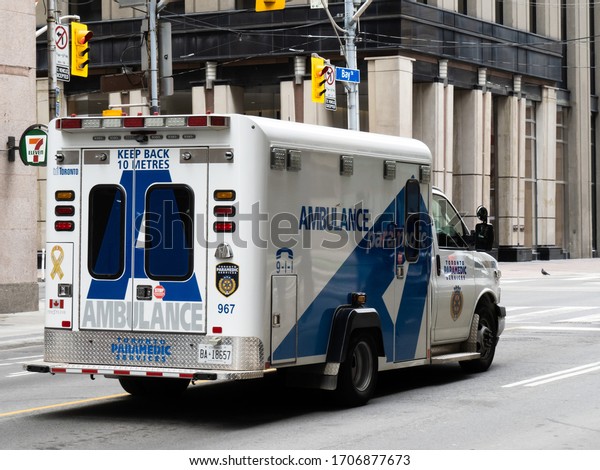 Toronto Canada April 17, 2020; A Toronto EMS\
paramedic ambulance on Bay\
Street