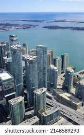 TORONTO, CANADA - APRIL 17, 2022: View of the buildings in Downtown Toronto and the Lake Ontario as seen from the CN Tower.
