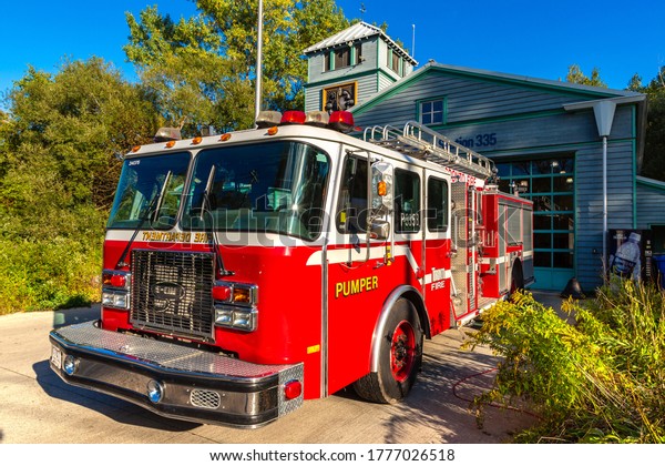 TORONTO, CANADA - APRIL 2,\
2020: Fire truck at a fire station in Toronto in a sunny day,\
Ontario, Canada