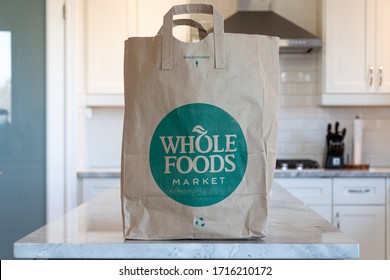 TORONTO, CANADA - April 20, 2020: Whole Foods Market Grocery Bag Placed On The Counter In A Kitchen.