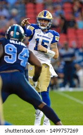 Toronto, Canada - Aug 1, 2019: Winnipeg Blue Bombers Quarterback Matt Nichols (15) Throwing Down Field During Winnipeg Blue Bombers At Toronto Argonauts Game At BMO Field In Toronto, ON 