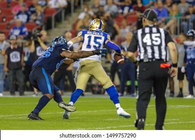 Toronto, Canada - Aug 1, 2019: Winnipeg Blue Bombers Quarterback Matt Nichols (15) Getting Sacked During Winnipeg Blue Bombers At Toronto Argonauts At BMO Field In Toronto, ON 