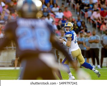 Toronto, Canada - Aug 1, 2019: Winnipeg Blue Bombers Quarterback Matt Nichols (15) Getting His Feet Set To Throw During Winnipeg Blue Bombers At Toronto Argonauts Game At BMO Field In Toronto, ON