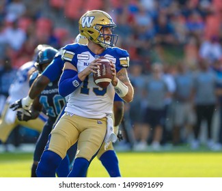 Toronto, Canada - Aug 1, 2019: Winnipeg Blue Bombers Quarterback Matt Nichols (15) Getting His Feet Set During Winnipeg Blue Bombers At Toronto Argonauts Game At BMO Field In Toronto, ON