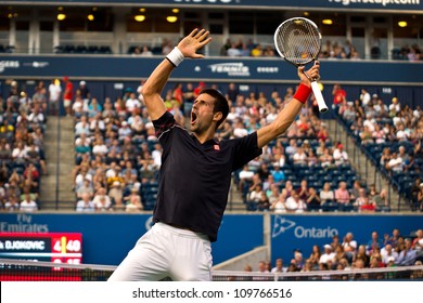 TORONTO, CANADA - AUG 8:  Novak Djokovic  Celebrates In Style After A Long Rally Against Bernard Tomic At The Rogers Cup ATP Tour Masters 1000 Event In Toronto, Canada On Wednesday August 8th, 2012.