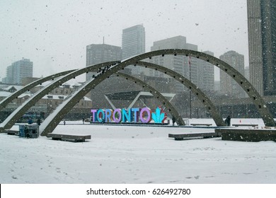 Toronto, Canada, Circa February 2017: Nathan Phillips Square In Snowy Winter And Toronto Sign.