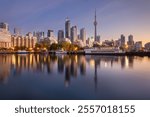 Toronto, Canada city skyline with Harbourfront at dawn on Lake Ontario.