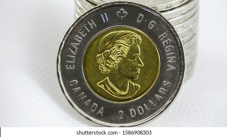 TORONTO CANADA - DEC 12 2019: Canadian $2 Dollar Coin Or Toonie On White Background