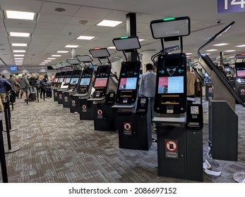 Toronto, Canada - Dec 4 2021: Automated border clearance machines in a row at Toronto International Pearson Airport arrival. Selective focus. Travel and border crossing, airport chaos concept. 
