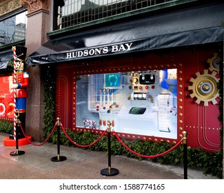 Toronto Canada, December 14 2019; Hudson's Bay and Saks Fifth Avenue Christmas display window on Queen Street seen from the sidewalk on a cold drizzly day in December in Toronto