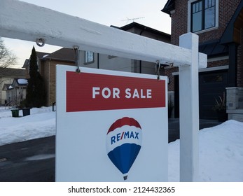 Toronto Canada Feb 15 2022: Sign For Sale By Remax In Front Of A Detached House In Residential Area. Real Estate Bubble, New Listings, Hot Housing Market, Overpriced Property, Buyer Activity Concept