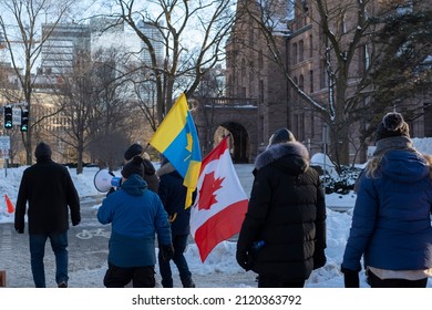 Toronto Canada Feb 2022: People With Canadian And Ukrainian Flags In Toronto Downtown. Canada Ukraine Humanitarian Aid, Support, Refugees Resettlement, Relationships, Solidarity, Unity Concept.