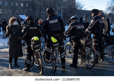 Toronto Canada Feb 5 2022: Bicycle Police At The Peaceful Protest Against Covid 19 Mandates And Restrictions And Mandatory Vaccination In Toronto City Downtown.