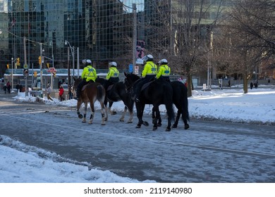 Toronto Canada Feb 5 2022: Mounted Police Patrolling Streets At Peaceful Protest Against Covid 19 Mandates And Restrictions And Mandatory Vaccination In Toronto City Downtown.