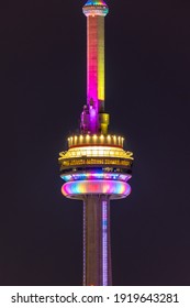 Toronto, Canada - February 14, 2021 : The CN Tower Colorfully Lit Up At Night With Rainbow Pride Colors. 