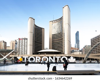 Toronto, Canada, February 3, 2020; Toronto City Hall Skating Rink With The Illuminated Toronto Sign In Winter