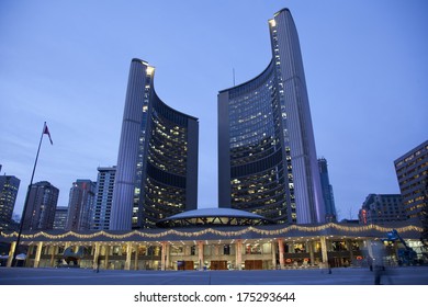 TORONTO, CANADA - JANUARY 17, 2014: Toronto's City Hall On Nathan Phillips Square At Night - Home Of Municipal Government Of Toronto, Ontario. It Was Designed By Architect Viljo Revell.