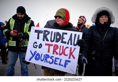 TORONTO, CANADA - JANUARY 27, 2022: People supporting the Freedom Convoy 2022 leaving Toronto to Ottawa.
